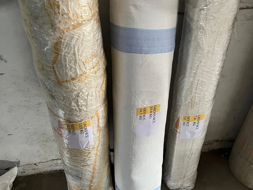 Belting and roll goods wrapped and weight-labelled for dispatch